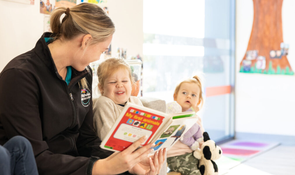 Educator reading to children at Lochinvar early education centre