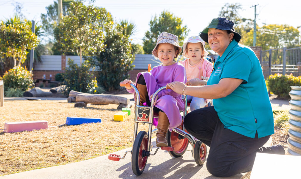 Children and educator on bikes outside at Lochinvar early education centre