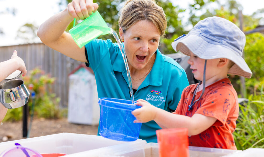 Child and educator playing with water at Branxton early education centre