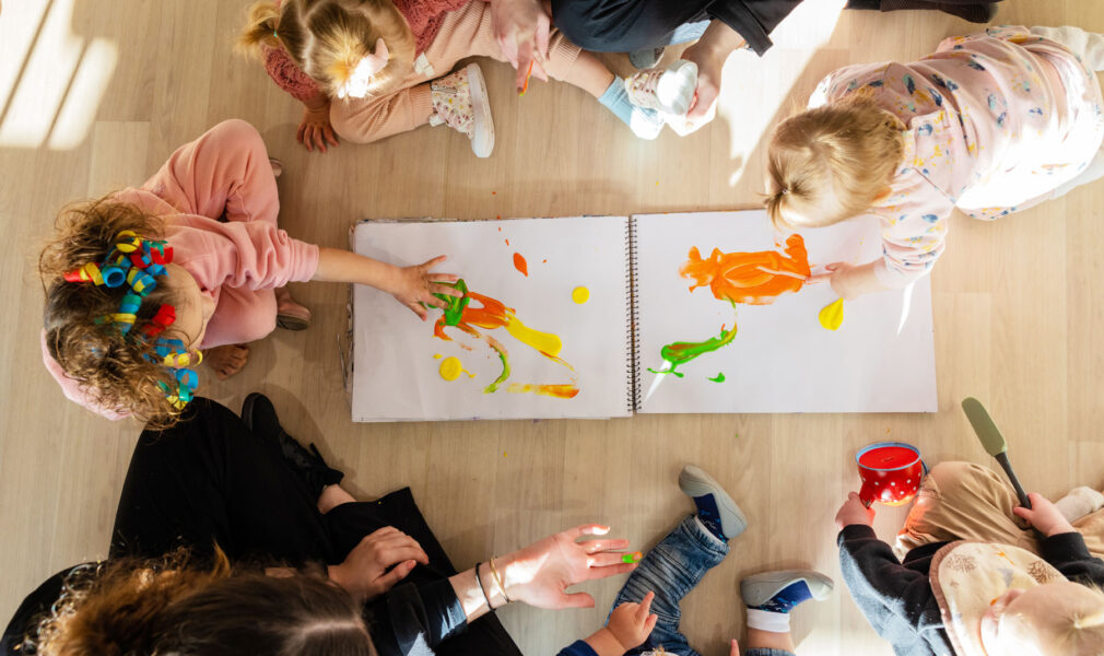 Children and educators painting at Gillieston Heights early education centre