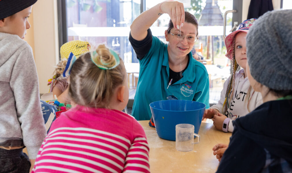 Children and educator making playdough at Gillieston Heights early education centre