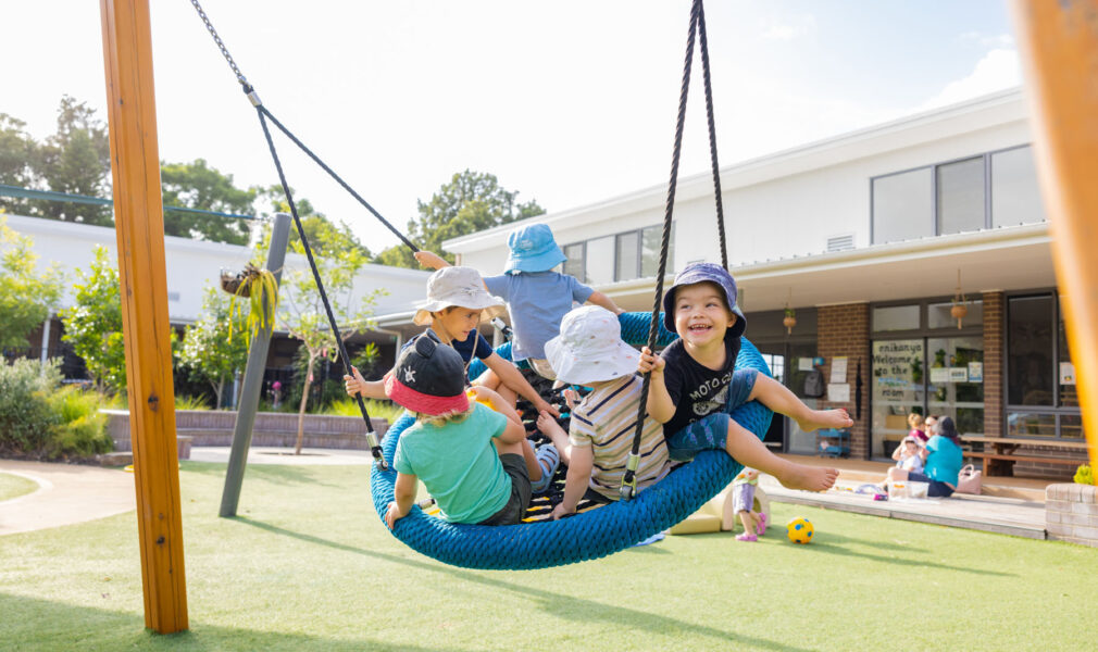 Children on a swing together at Maitland early education centre