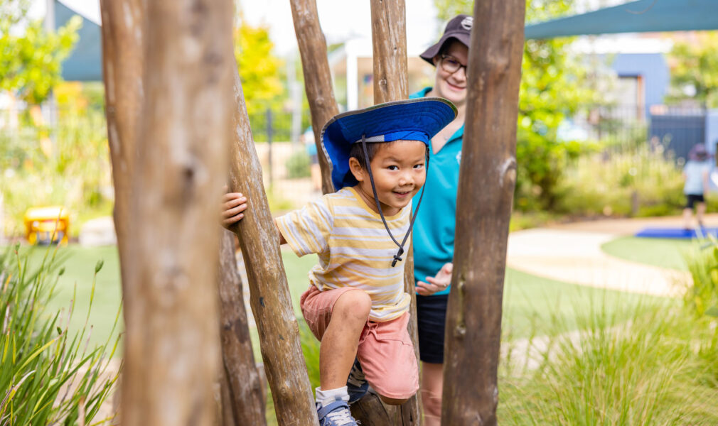 Child climbing outside at Maitland early education centre