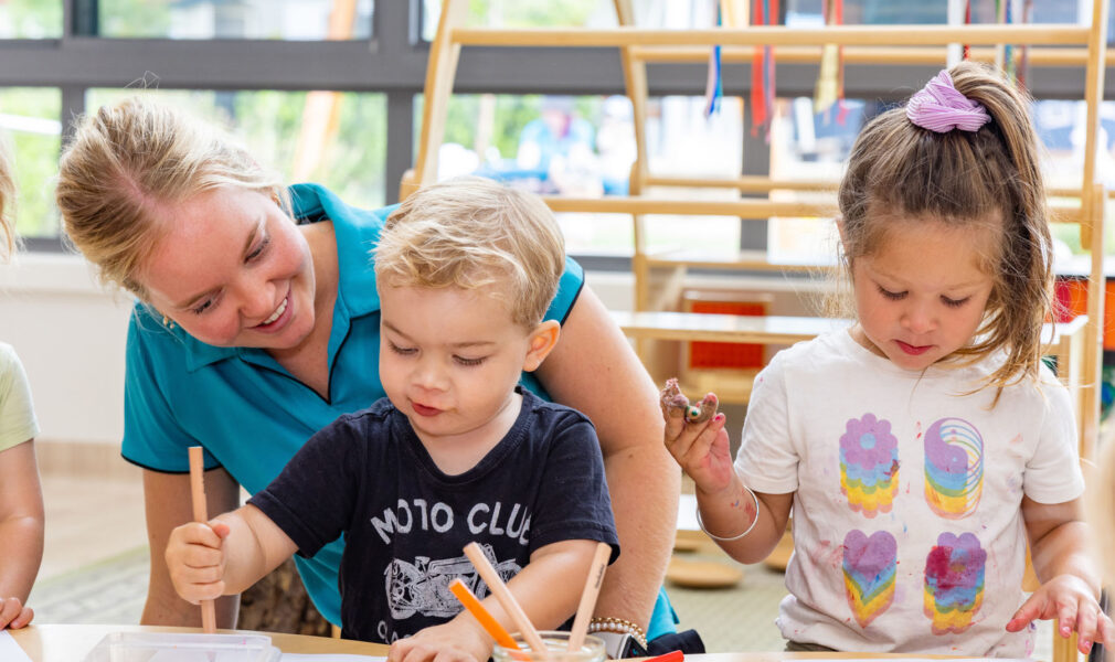 Children and educator working on an art project inside at Maitland early education centre