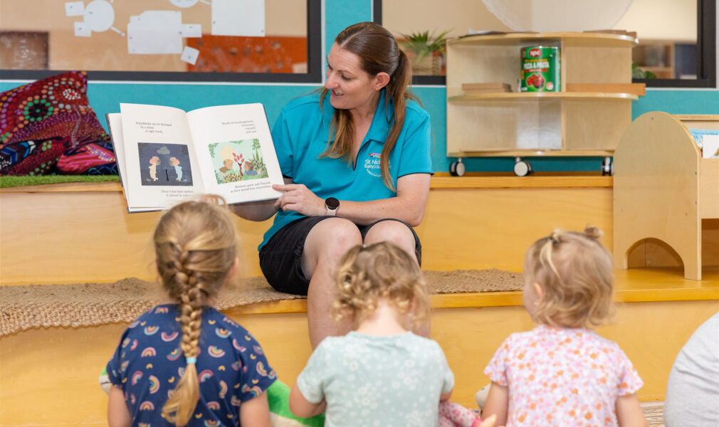 Educator reading to children at Muswellbrook early education centre