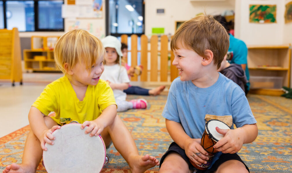 Children playing with musical instruments together at Newcastle West early education centre