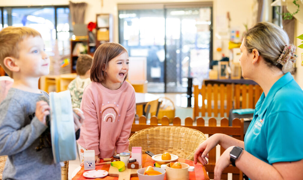 Children and educator engaged in dramatic playing inside at Singleton early education centre