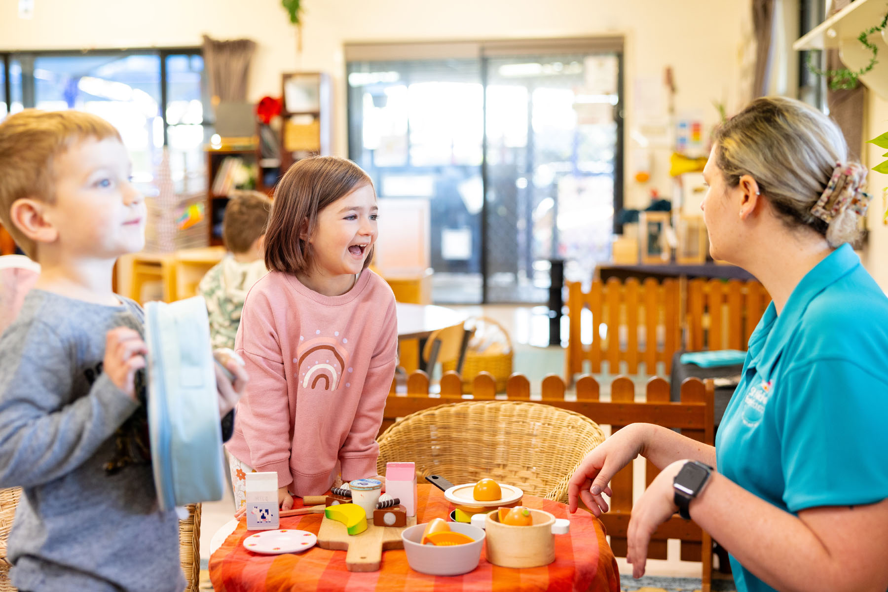 Children and educator engaged in dramatic play indoors at Singleton early education centre