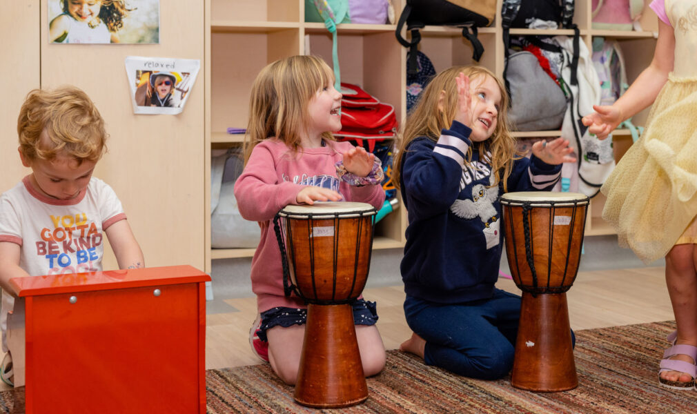Children playing with musical instruments at Cardiff early education centre