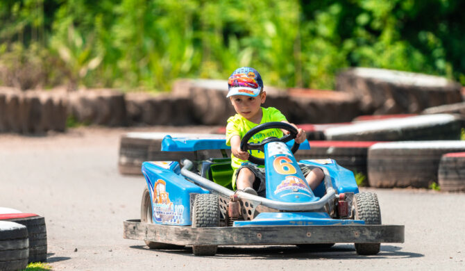 Children in go karts at vacation care