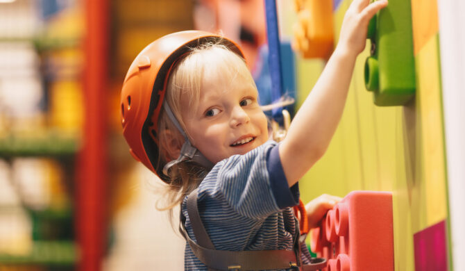 Children rock climbing at vacation care